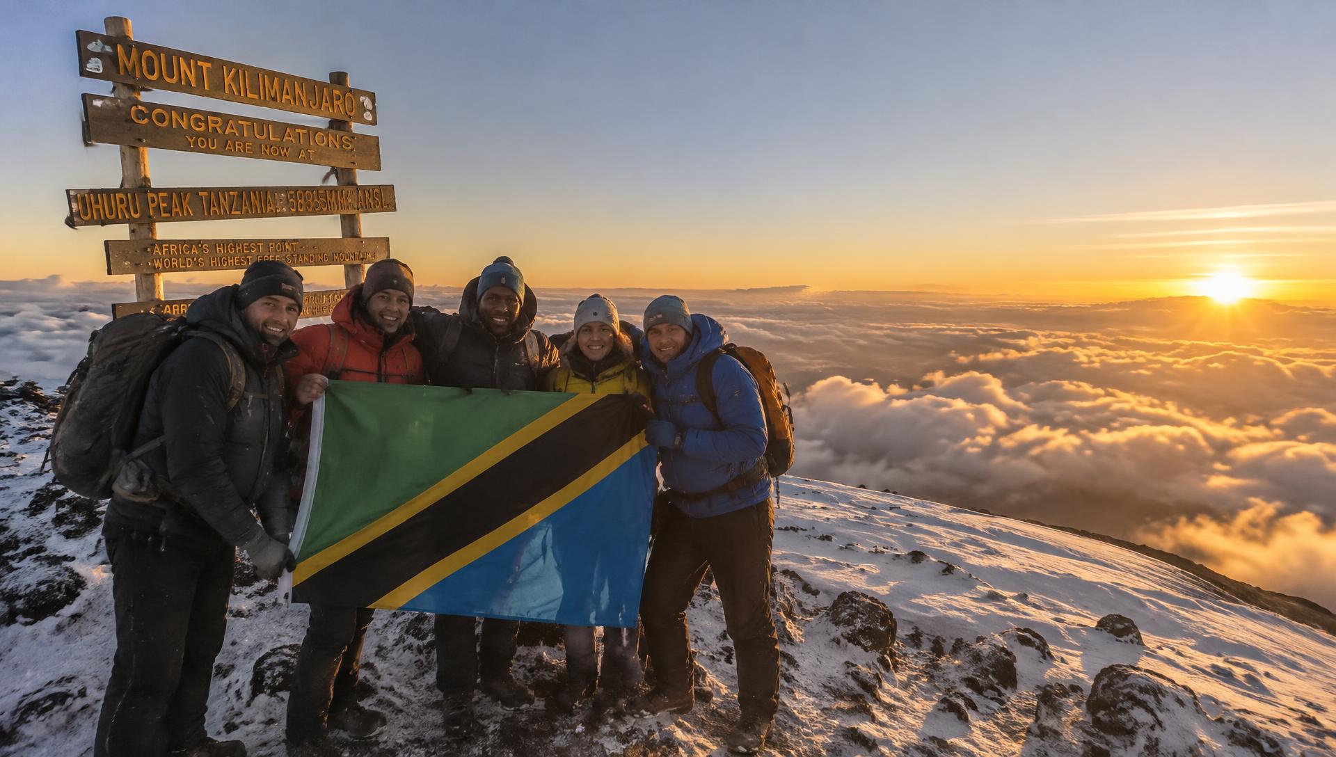 The WSI climbing team at the summit of Mount Kilimanjaro at sunrise